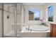 Luxurious bathroom featuring a separate shower and a soaking tub with tile at 13250 Wild Basin Way, Broomfield, CO 80020
