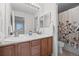 Functional bathroom with double sinks and a private toilet area at 13250 Wild Basin Way, Broomfield, CO 80020