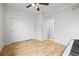 Cozy bedroom featuring hardwood floors, closet, and ample natural light at 13250 Wild Basin Way, Broomfield, CO 80020