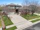 Beautiful two-story home with a three-car garage, brick accents, and mature trees enhancing the curb appeal at 13250 Wild Basin Way, Broomfield, CO 80020