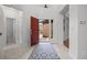 Bright foyer with tile flooring, a vibrant front door, and an open layout, creating a welcoming entrance at 13250 Wild Basin Way, Broomfield, CO 80020
