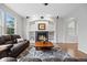 Comfortable living room with a fireplace, built-in shelving, and hardwood floors, perfect for relaxation at 13250 Wild Basin Way, Broomfield, CO 80020