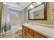 Cozy bathroom with an updated vanity and shower/tub combo, offering a relaxing and functional space at 11957 Claude Ct, Northglenn, CO 80233