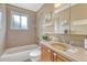 Traditional bathroom featuring a tub and shower combo and a vanity sink at 11957 Claude Ct, Northglenn, CO 80233
