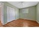 The bedroom features wood-look flooring, ample closet space, and natural light from a window at 11957 Claude Ct, Northglenn, CO 80233
