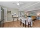 Open kitchen and dining area offers a view into the living room, perfect for modern living at 11957 Claude Ct, Northglenn, CO 80233