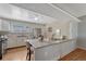 Well-lit kitchen featuring stainless steel appliances and a cozy breakfast bar for casual dining at 11957 Claude Ct, Northglenn, CO 80233