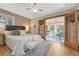 Cozy primary bedroom featuring hard wood floors and access to the sunroom at 11957 Claude Ct, Northglenn, CO 80233