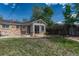 Backyard view of sun room addition with large sliding glass doors at 11957 Claude Ct, Northglenn, CO 80233