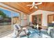 This cozy sunroom features wood ceilings, tile floors, and lots of natural light at 11957 Claude Ct, Northglenn, CO 80233