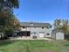 Backyard view featuring large patio with outdoor seating, plus a lawn and shed at 10640 W 46Th Ave, Wheat Ridge, CO 80033