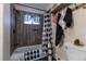 Charming bathroom featuring wood-look tile shower and buffalo check accents throughout at 10640 W 46Th Ave, Wheat Ridge, CO 80033