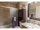 Bathroom features a shower/tub combo, cabinet, and classic vanity at 10640 W 46Th Ave, Wheat Ridge, CO 80033