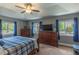 Bright bedroom boasts large windows, ceiling fan, and ample space at 10640 W 46Th Ave, Wheat Ridge, CO 80033