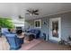 Relaxing covered patio featuring a cozy seating area and a convenient outdoor grill at 10640 W 46Th Ave, Wheat Ridge, CO 80033