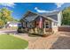 Charming home showcasing a welcoming front porch and beautifully landscaped yard at 10640 W 46Th Ave, Wheat Ridge, CO 80033