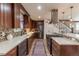 Gourmet kitchen with custom cabinets, sleek countertops, stainless steel appliances, and stylish backsplash at 10640 W 46Th Ave, Wheat Ridge, CO 80033