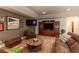 Basement living room features entertainment center and comfortable seating at 10640 W 46Th Ave, Wheat Ridge, CO 80033