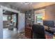 Comfortable home office with wood floors, natural light, and adjacent living area at 10640 W 46Th Ave, Wheat Ridge, CO 80033