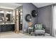 Ensuite bathroom with dual vanities, modern lighting, and a walk-in closet at 9917 Grove Way # A, Westminster, CO 80031
