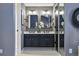 Bright bathroom featuring dual sinks, a modern vanity, and stylish fixtures at 9917 Grove Way # A, Westminster, CO 80031