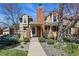 Charming exterior of a two-story home featuring a brick chimney, manicured landscaping, and a welcoming front entrance at 9917 Grove Way # A, Westminster, CO 80031