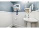 Updated bathroom with pedestal sink and wainscoting at 5510 W 103Rd Ave, Westminster, CO 80020