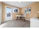 Bright home office features a desk, window, and door to a deck at 5510 W 103Rd Ave, Westminster, CO 80020