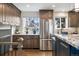 Modern kitchen with stainless steel appliances and custom cabinetry at 5510 W 103Rd Ave, Westminster, CO 80020