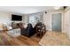 Living area with hardwood floors, a fireplace, and a view of the entry way at 5510 W 103Rd Ave, Westminster, CO 80020