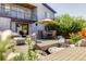 Outdoor patio features a dining area, lounge seating, and beautiful landscaping at 2048 Meade St, Denver, CO 80211