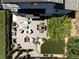 Aerial view of spacious deck with stylish outdoor furniture, fire pit, and lush landscaping at 2048 Meade St, Denver, CO 80211