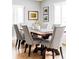 Bright dining room featuring a rustic wood table with seating for six and stylish decor at 2048 Meade St, Denver, CO 80211