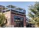 Exterior of Odell Brewing Co with rooftop patio, brick facade, and clear signage in a commercial setting at 2048 Meade St, Denver, CO 80211