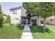 Contemporary home featuring a manicured lawn and a walkway leading to a modern front door, framed by a mature tree at 2048 Meade St, Denver, CO 80211
