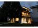 Charming home exterior at twilight showcasing a modern design and beautifully landscaped front yard at 2048 Meade St, Denver, CO 80211