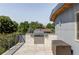 Rooftop patio with a built in grill, stone backsplash, and view of the city at 2048 Meade St, Denver, CO 80211