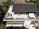 Spacious rooftop deck featuring a hot tub, outdoor kitchen, and comfortable seating area at 2048 Meade St, Denver, CO 80211