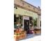 Charming storefront of a plant shop featuring a decorative facade and colorful flower arrangements at 2048 Meade St, Denver, CO 80211