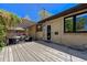 Spacious wooden deck perfect for outdoor entertaining, featuring a pergola and shaded seating area at 3245 S High St, Englewood, CO 80113