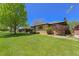 Charming home with well-maintained front lawn and mature tree at 3245 S High St, Englewood, CO 80113
