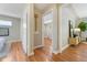 Hardwood hallway displaying doors to the bed and bathroom, neutral-toned walls, and recessed lighting at 3245 S High St, Englewood, CO 80113