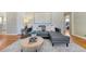 Cozy living room showcasing hardwood floors, plush seating, and tasteful decor at 3245 S High St, Englewood, CO 80113