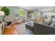 Inviting living room boasts hardwood floors, contemporary decor, and natural light at 3245 S High St, Englewood, CO 80113