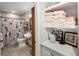 This bathroom features a charming floral shower curtain and classic fixtures at 2190 S Uravan St, Aurora, CO 80013