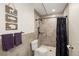 Updated bathroom showcasing tiled walls, a walk-in shower with a black curtain, and matching fixtures at 2190 S Uravan St, Aurora, CO 80013