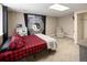 This basement bedroom is complete with modern furnishings and neutral carpeting at 2190 S Uravan St, Aurora, CO 80013