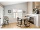 Cozy dining area with natural light, fireplace, and modern furnishings, seamlessly connected to the living spaces at 2190 S Uravan St, Aurora, CO 80013