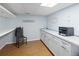 This laundry room has laminate floors, plus countertop and cabinets for storage at 2190 S Uravan St, Aurora, CO 80013