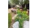 Beautifully landscaped backyard features mature bushes, mulch beds and several large rocks at 12742 Clermont St, Thornton, CO 80241